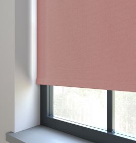 Our Amor Soft Peach Roller blind in a living room window.