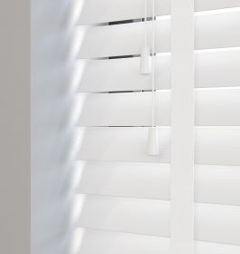 Editions Angel White With Lilly Tapes - White wooden venetian blind with slats in the closed position and bright white tapes