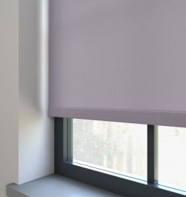 A light purple dimout roller blind in a window