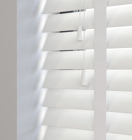 Editions Ultra Pure With Lilly Tape - A front on view of a white wooden venetian blind with the slats in a closed position